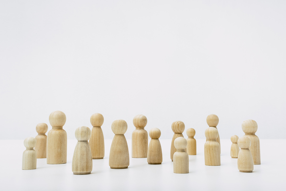 Wooden Figures Shaped as People Grouped in Solidarity 